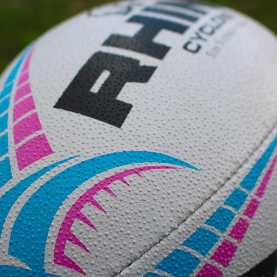 Ballon de Rugby Cyclone Blanc/Bleu Clair/Rose Taille 4